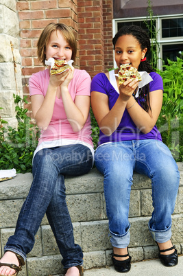 Girls eating pizza