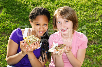 Girls eating pizza