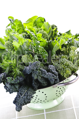 Dark green leafy vegetables in colander