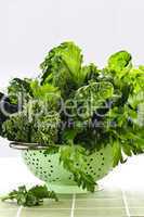 Dark green leafy vegetables in colander