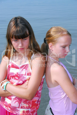 Two girls pouting