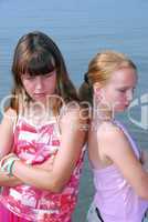 Two girls pouting