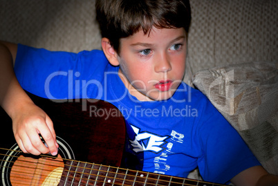 Boy play guitar