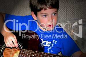 Boy play guitar
