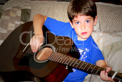 Boy play guitar