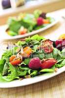 Green salad with berries and tomatoes