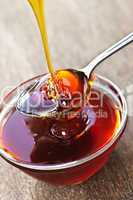 Honey dripping onto spoon