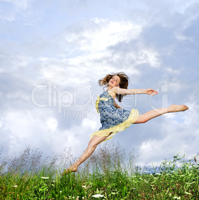 Young girl jumping in meadow