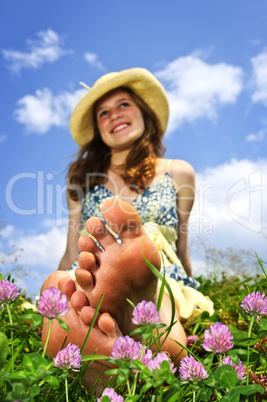 Young girl sitting on meadow