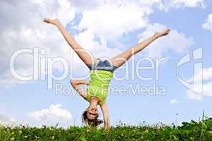 Young girl doing cartwheel