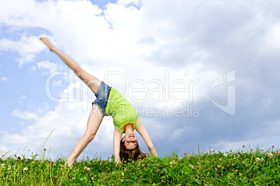Young girl doing cartwheel