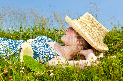 Young girl resting in meadow