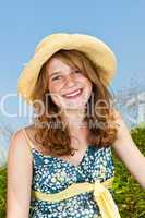 Portrait of young girl smiling in meadow