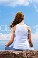 Young girl meditating outdoors