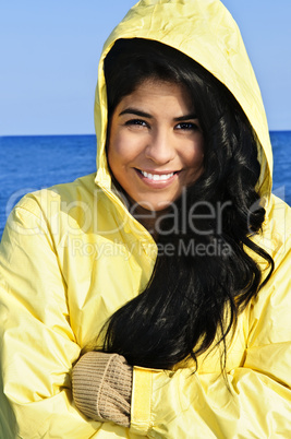 Beautiful young woman in raincoat