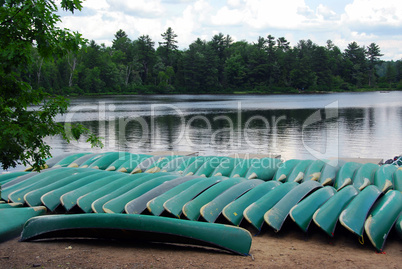 Canoes on lake shore