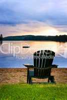 Wooden chair at sunset on beach