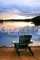 Wooden chair at sunset on beach