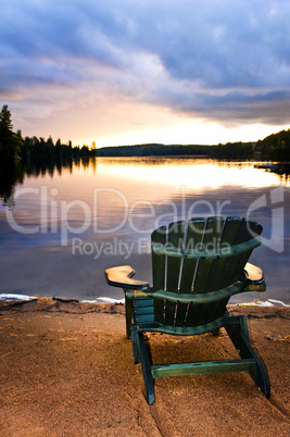 Wooden chair at sunset on beach