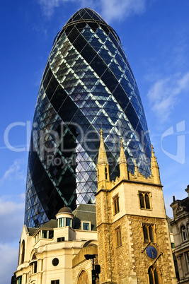 Gherkin building and church of St. Andrew Undershaft in London