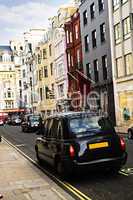 London taxi on shopping street