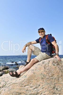 Hiker sitting on a rock