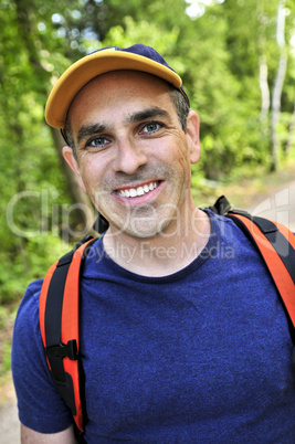 Man hiking on forest trail
