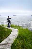 Father and son at Atlantic coast in Newfoundland