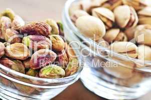 Pistachio nuts in glass bowls