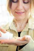 Mature woman with pills