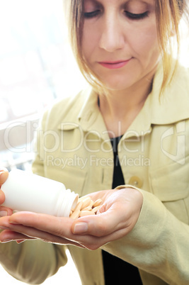 Mature woman with pills