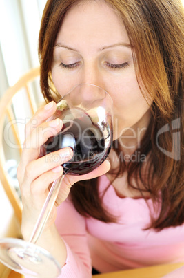 Mature woman with a glass of red wine