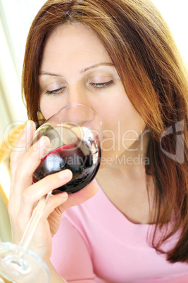 Mature woman with a glass of red wine