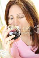 Mature woman with a glass of red wine