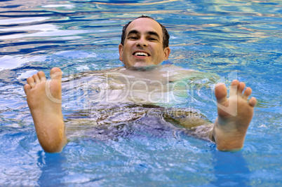 Man swimming in pool