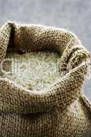 Long grain rice in burlap sack