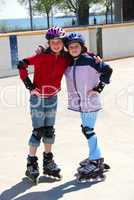 Two girls rollerblading