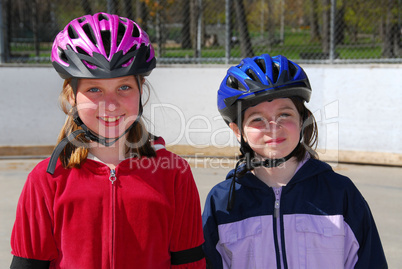 Two girls rollerblading