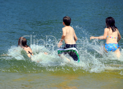 Children running into water