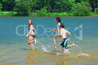 Children running into water