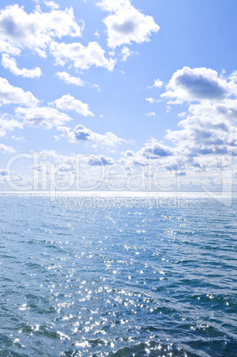 Blue water and sunny sky background