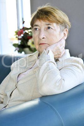 Sad elderly woman