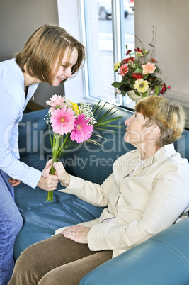 Granddaughter visiting grandmother