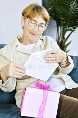 Old woman opening present