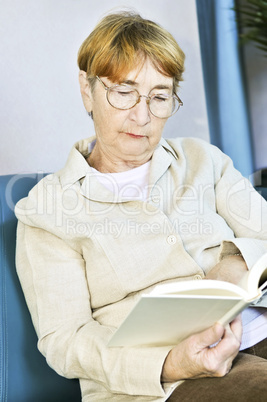 Old woman reading book