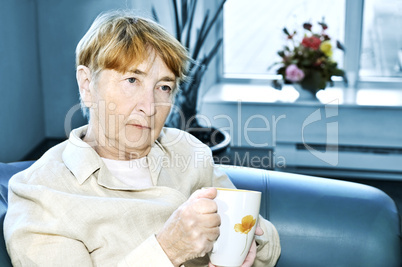 Sad elderly woman