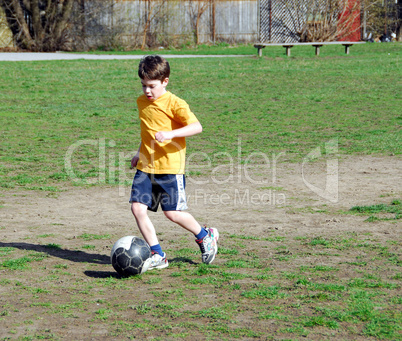 Boy playing soccer