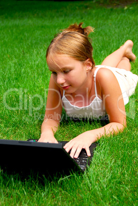Girl computer grass