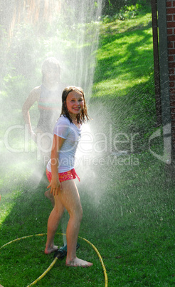 Girls and sprinkler