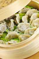 Bamboo steamer with dumplings